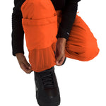 North Face Boys' Freedom Insulated Pant - A pair of orange snow pants with a black logo on the left leg, featuring a zippered pocket and adjustable cuffs.