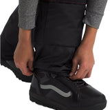 North Face Boys' Freedom Insulated Pant - A pair of black insulated pants with a red stripe on the waistband, worn by an adult model.