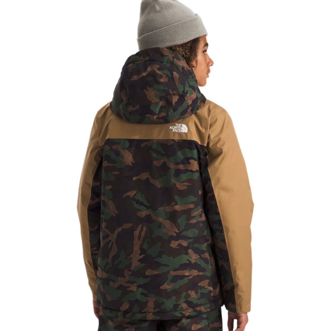 North Face Boys' Freedom Insulated Jacket - A boy wearing a tan and green camouflage jacket with a hood, standing in front of a white background.
