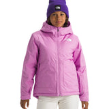 North Face Girls' Freedom Insulated Jacket - A young girl wearing a pink jacket with a white logo on the left chest and a hood, standing against a light gray background.