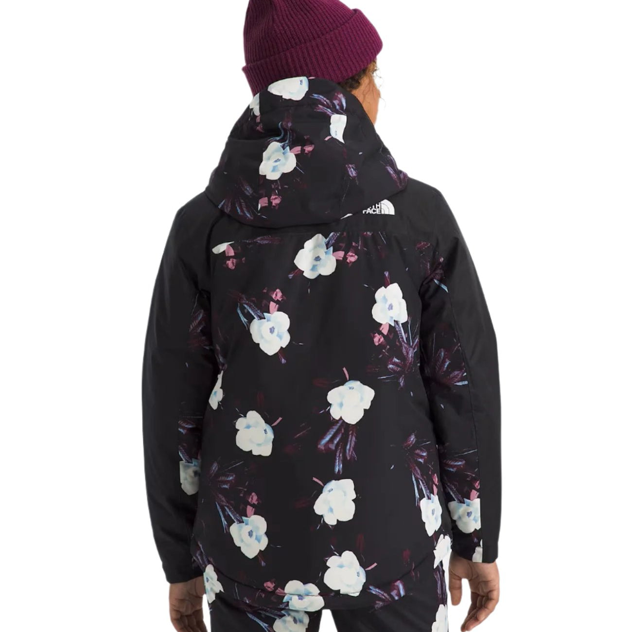 North Face Girls' Freedom Insulated Jacket 2025 - A black jacket with a white floral pattern and blue accents.