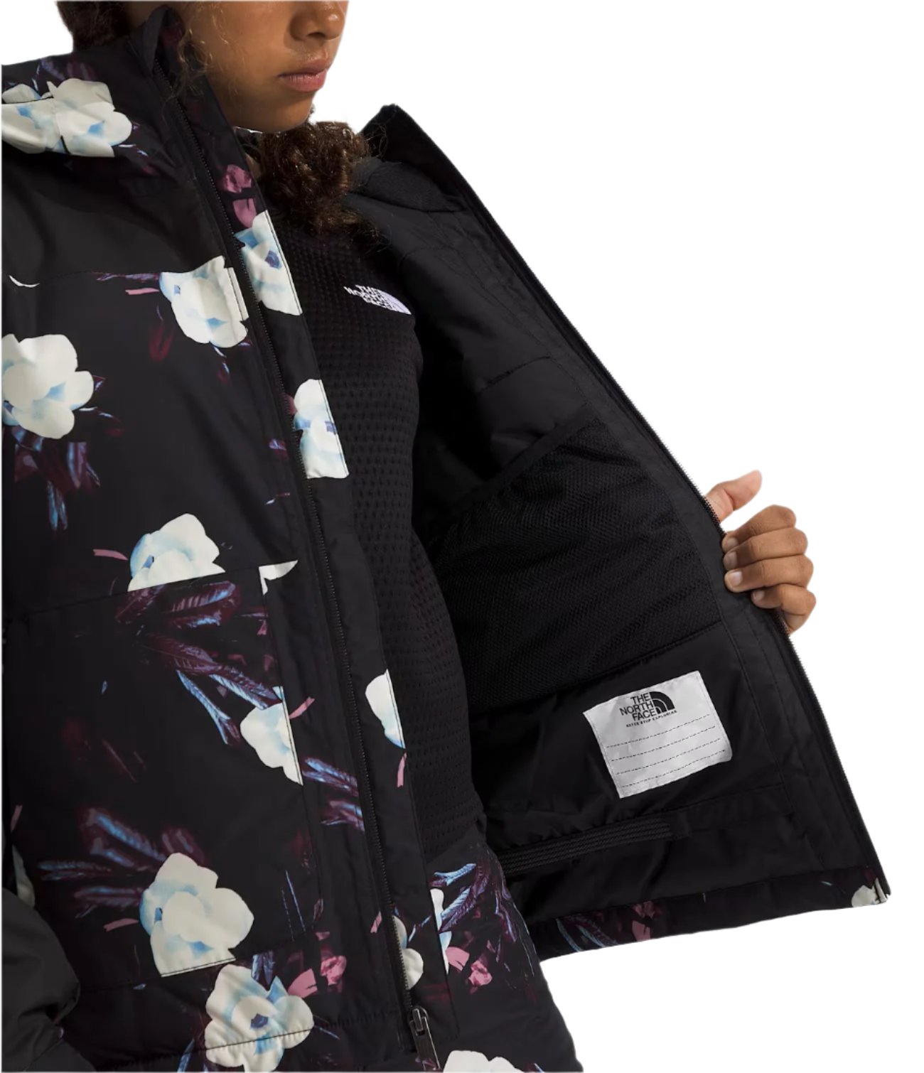 North Face Girls' Freedom Insulated Jacket - A black jacket with a white logo on the left chest and a floral pattern of white, blue, and purple flowers.