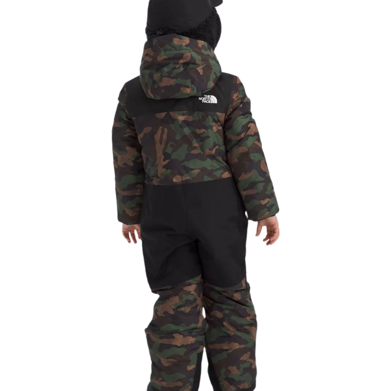 North Face Junior's Freedom Insulated Snow Suit 2025 - A child wearing a camouflage-print snowsuit with black accents and a white logo on the back, facing away from the camera.
