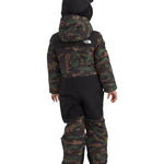 North Face Junior's Freedom Insulated Snow Suit 2025 - A child wearing a camouflage-print snowsuit with black accents and a white logo on the back, facing away from the camera.