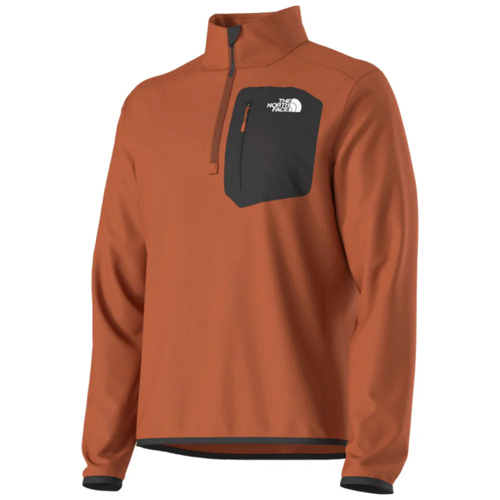 North Face Crest 1/4 Zip Pull Over 2025 - A burnt orange fleece pullover with a zippered chest pocket and white logo on the left side of the chest.