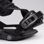 Nidecker Kaon Snowboard Binding - A black snowboard binding with a circular logo on the strap and a textured surface.