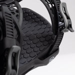 Nidecker Kaon Snowboard Binding 2025 - A black snowboard binding with a honeycomb pattern on its baseplate.