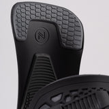 Nidecker Kaon Snowboard Binding 2025 - A black snowboard binding with a circular logo featuring an "N" and two parallel lines, positioned at the top center of the baseplate.