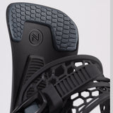 Nidecker Kaon Snowboard Binding 2025 - A black snowboard binding with a honeycomb pattern on top and a circular logo featuring an "N" in the center.