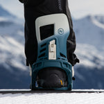 Nidecker Muon-X Bindings 2025 - A pair of blue and white snowboard bindings with a rectangular window on the top of each boot holder.