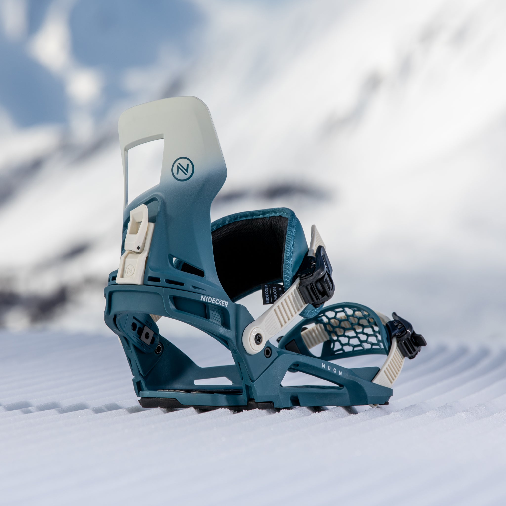 Nidecker Muon-X Bindings 2025 - A pair of blue and white snowboard bindings with a distinctive geometric pattern on the straps.