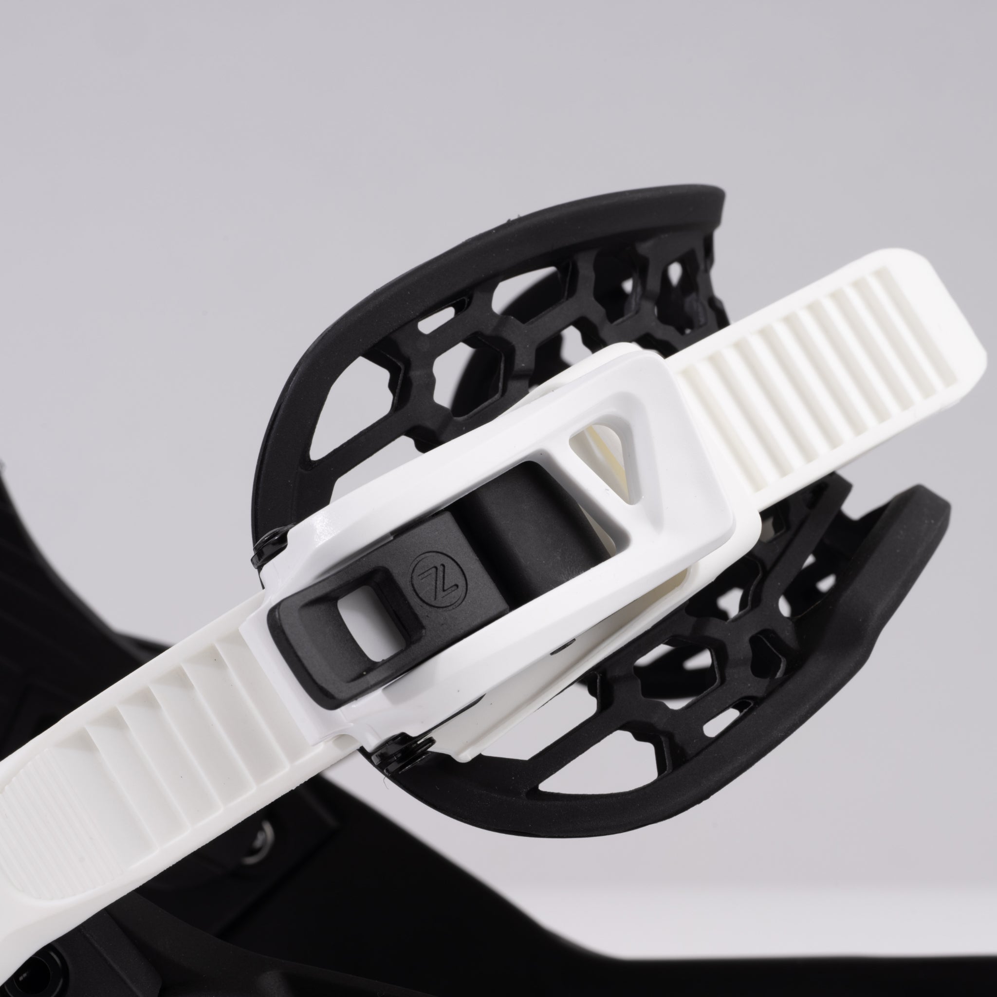 Nidecker Prime Youth Snowboard Bindings 2025 - A pair of black snowboard bindings with white straps and buckles.