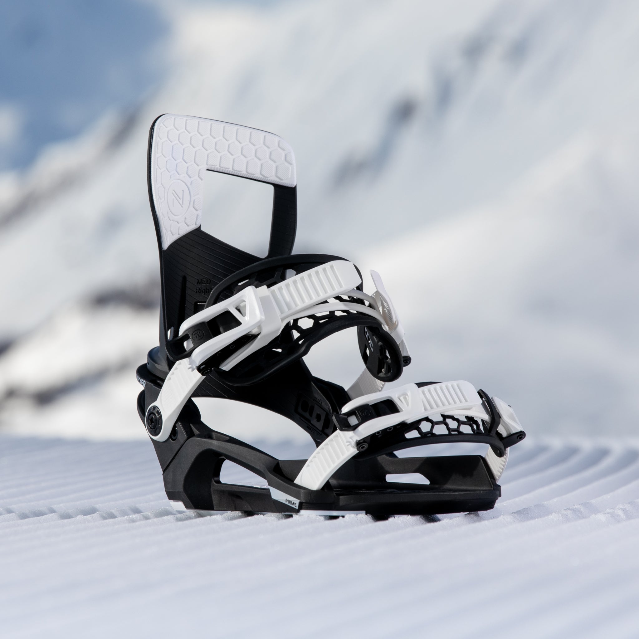 Nidecker Prime Youth Snowboard Bindings 2025 - A pair of black and white snowboard bindings with a geometric pattern on the straps.