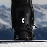 Nidecker Prime Youth Snowboard Bindings 2025 - A pair of black snowboard bindings with white buckles and straps, featuring a sleek design on a snowy surface.