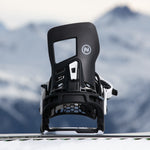 Nidecker Prime Youth Snowboard Bindings 2025 - A pair of black and white snowboard bindings with a rectangular window on the top of the left binding.
