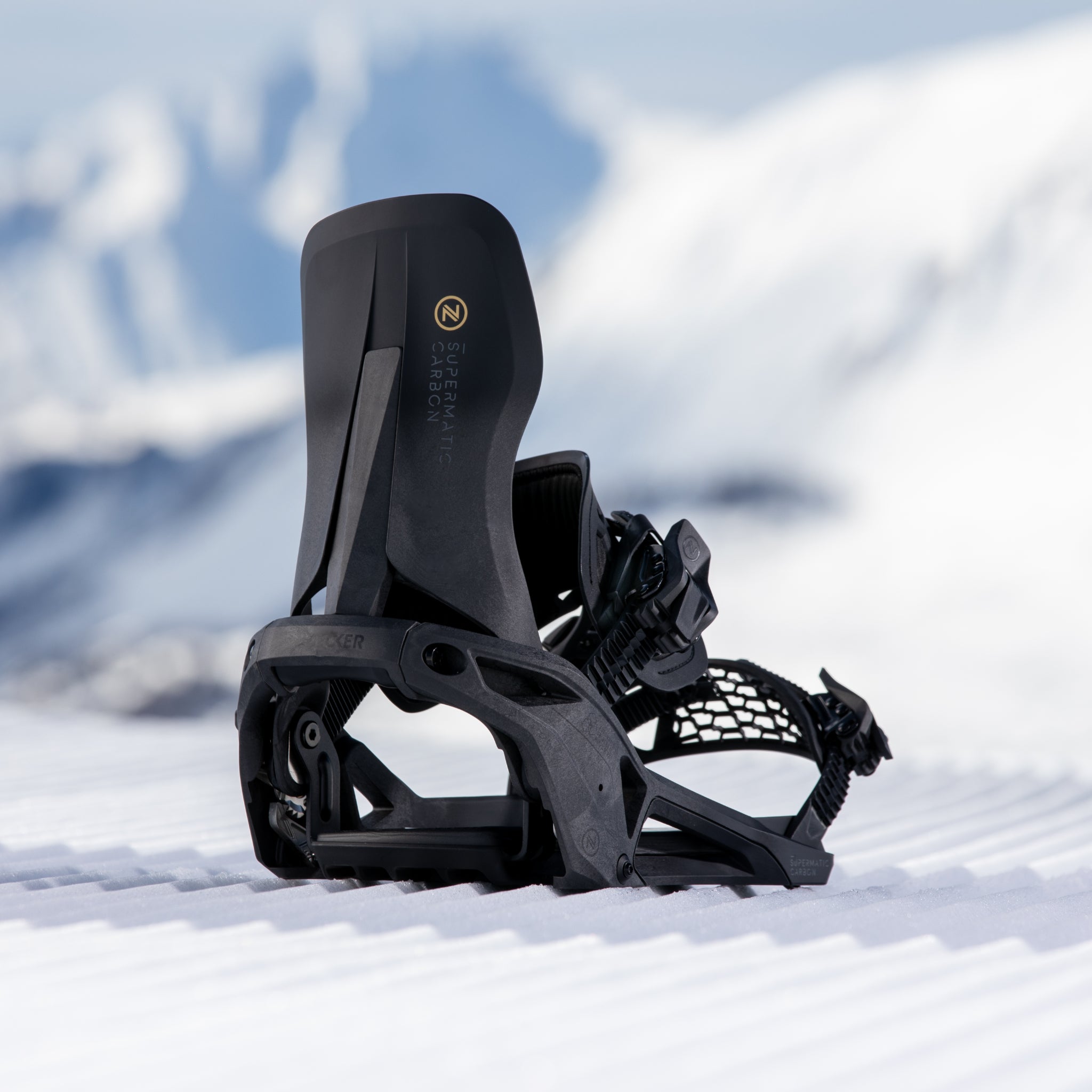 Nidecker Supermatic Carbon Snowboard Bindings - Black bindings with gold logo on top of black base plate.