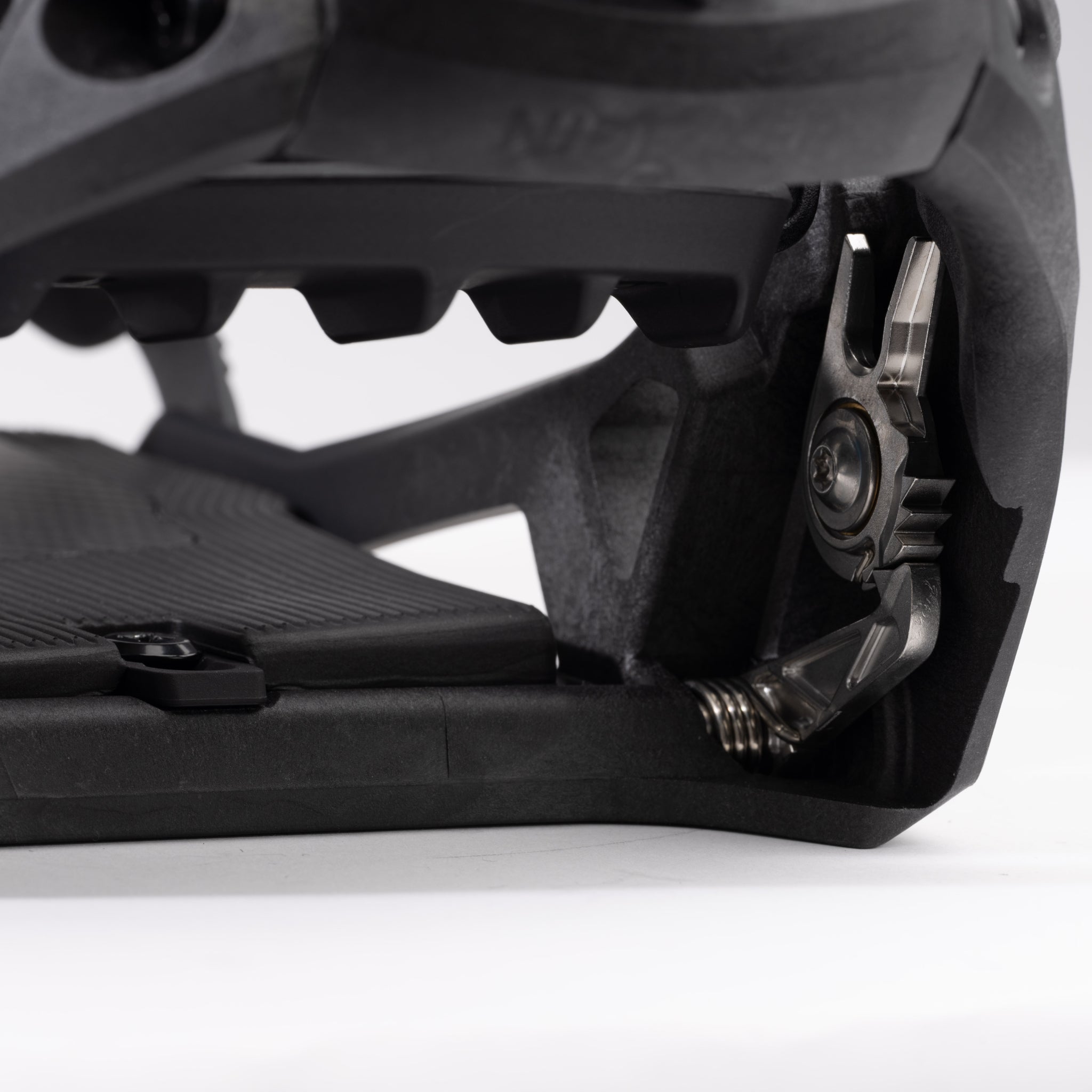 Nidecker Supermatic Carbon Snowboard Bindings 2025 - A pair of black snowboard bindings with silver screws and bolts.