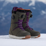 Nidecker Men's Altai Snowboard Boot 2025 - A pair of dark brown snowboard boots with purple accents and a black BOA dial on each side.