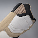 Nidecker Women's Cascade Snowboard Boot 2025 - A tan snowboard boot with a black strap and white accents on the toe and heel.
