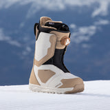Nidecker Women's Cascade Snowboard Boot 2025 - A tan and white snowboard boot with a black strap on top, featuring a brown dial on the side.