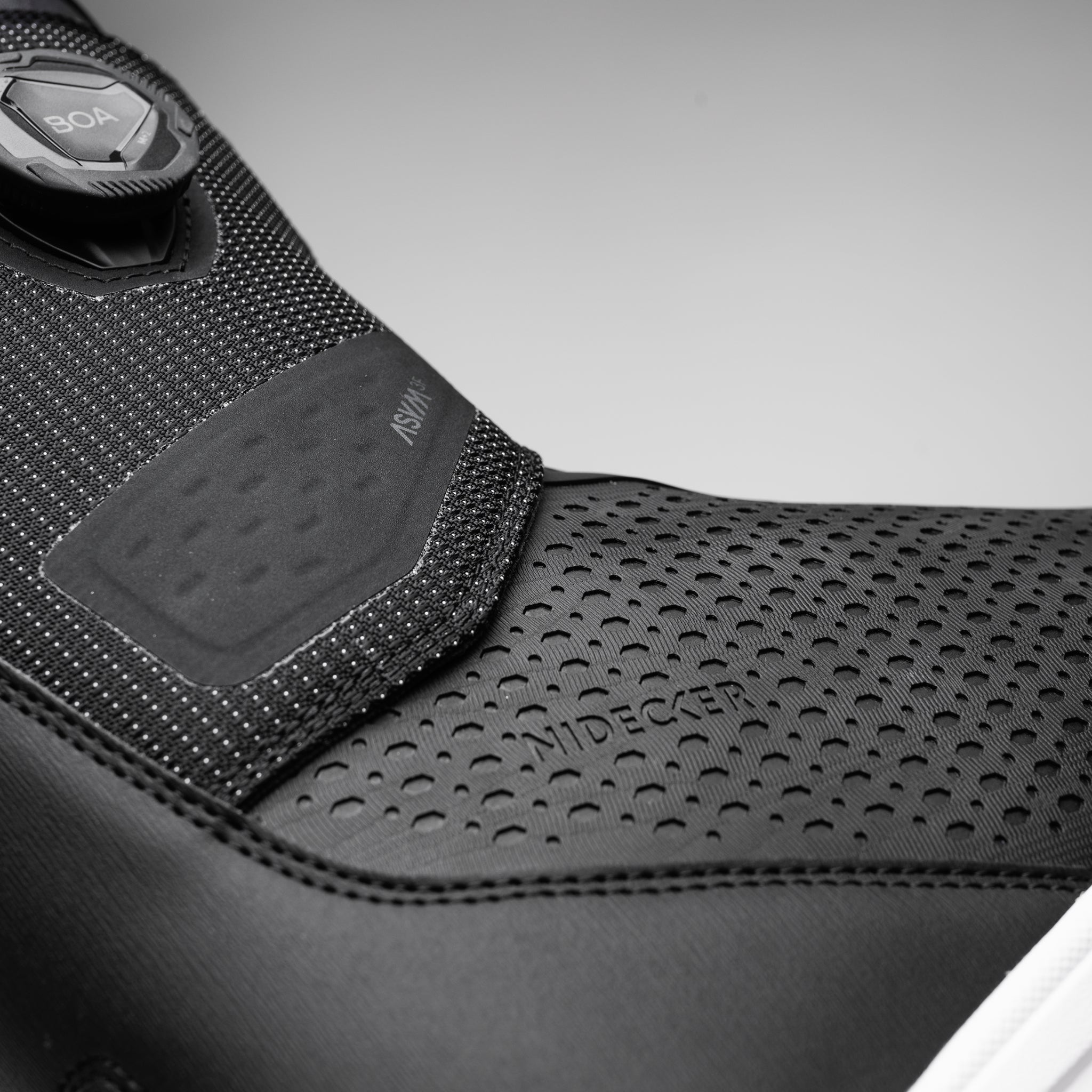 Nidecker Rift APX Men's Snowboard Boots 2025 - Black snowboard boots with a textured pattern on the toe and heel areas.