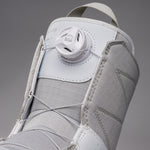 Nidecker Women's Sierra Snowboard Boots 2025 - A pair of white snowboard boots with a textured pattern on the toe and heel areas, featuring a round white dial labeled "SOA" in the center.