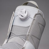 Nidecker Women's Sierra Snowboard Boots 2025 - A pair of white snowboard boots with a textured pattern on the toe and heel areas, featuring a round white dial labeled "SOA" in the center.