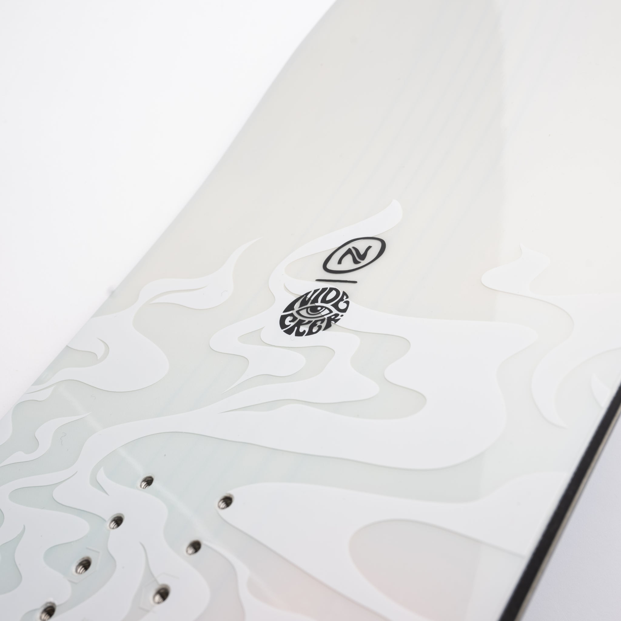 Nidecker Alpha Snowboard 2025 - A white snowboard with a black logo featuring an eye and the word "NIDECKER" in stylized font, positioned near the top of the board.