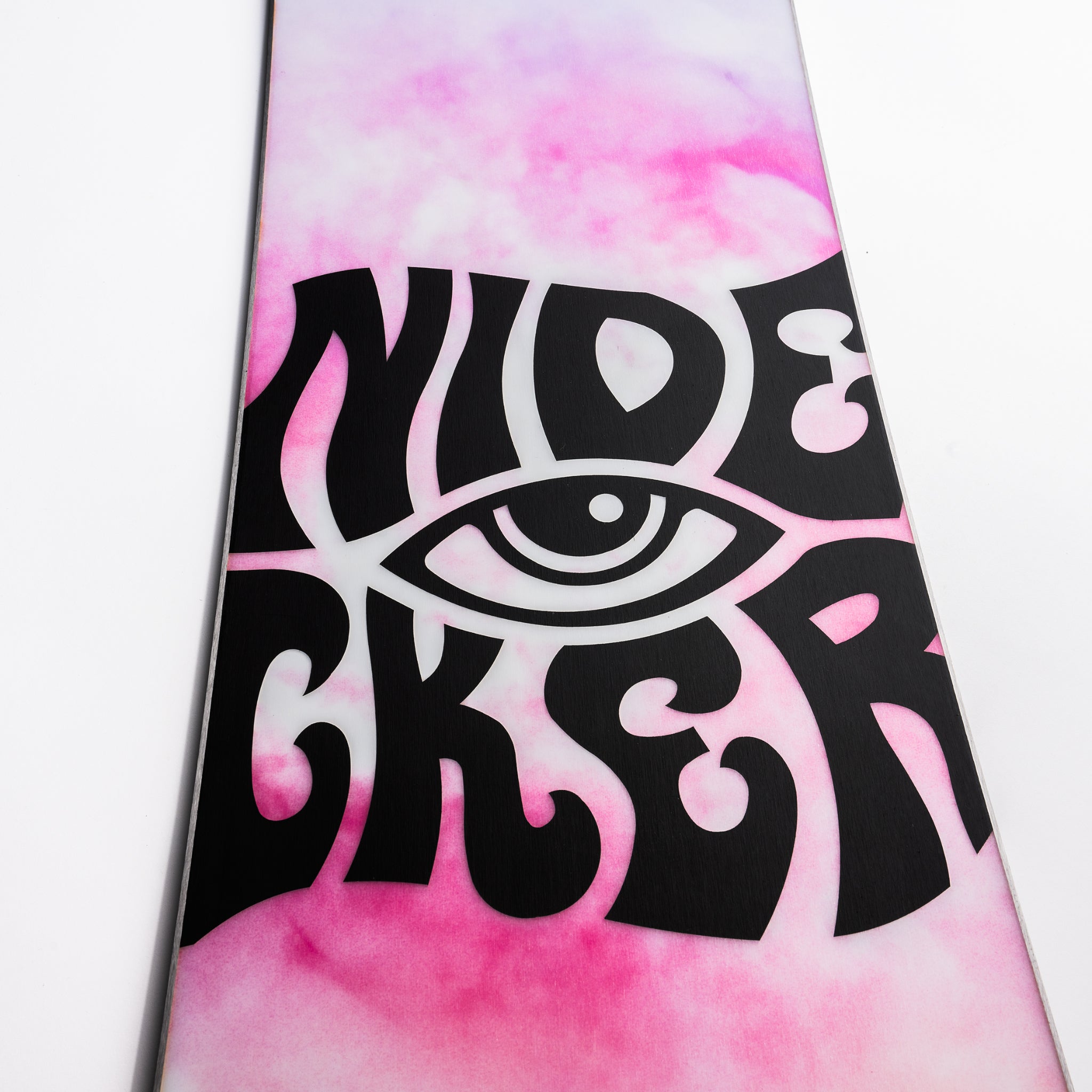 Nidecker Alpha Snowboard 2025 - A pink snowboard with a white logo featuring an eye and the word "NIDECKER" in black letters.