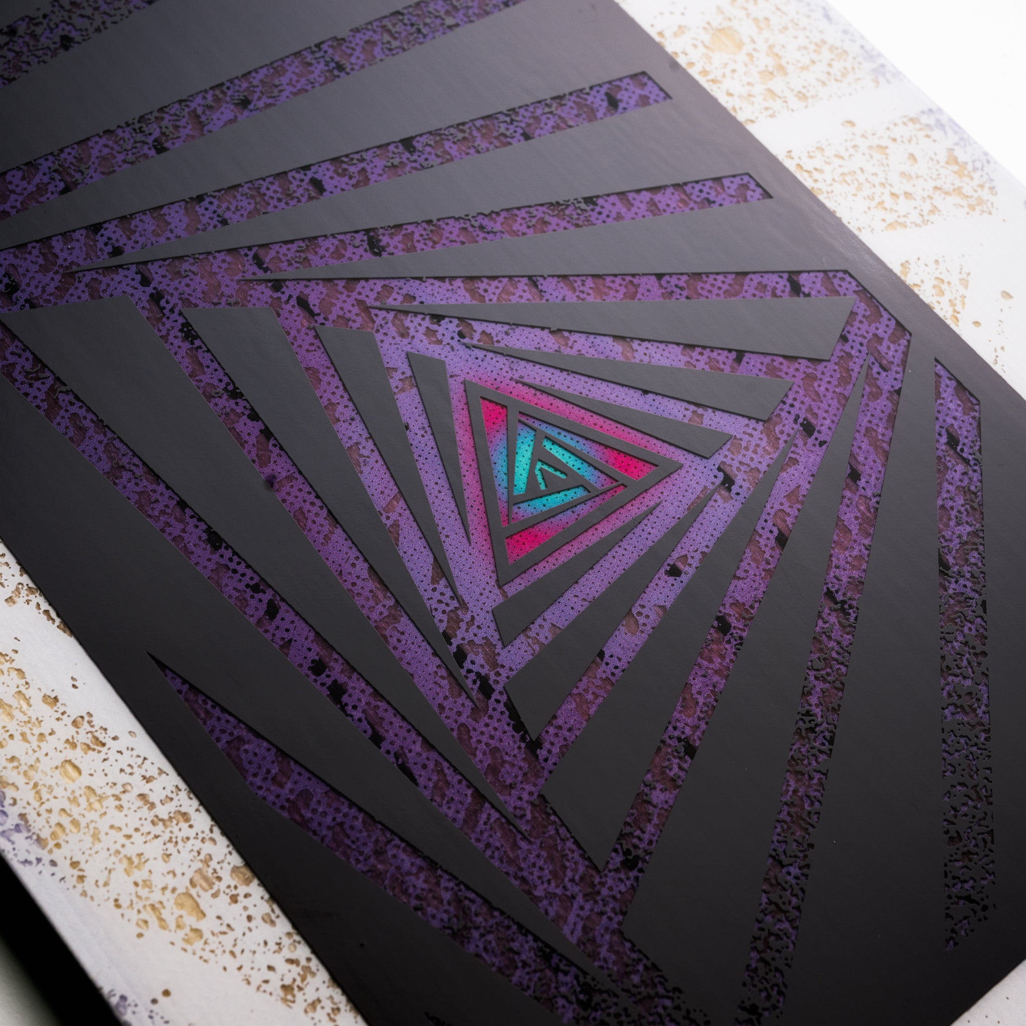 Nidecker Women's Astral Snowboard 2025 - A snowboard with a purple and black design, featuring a geometric pattern on its top surface.