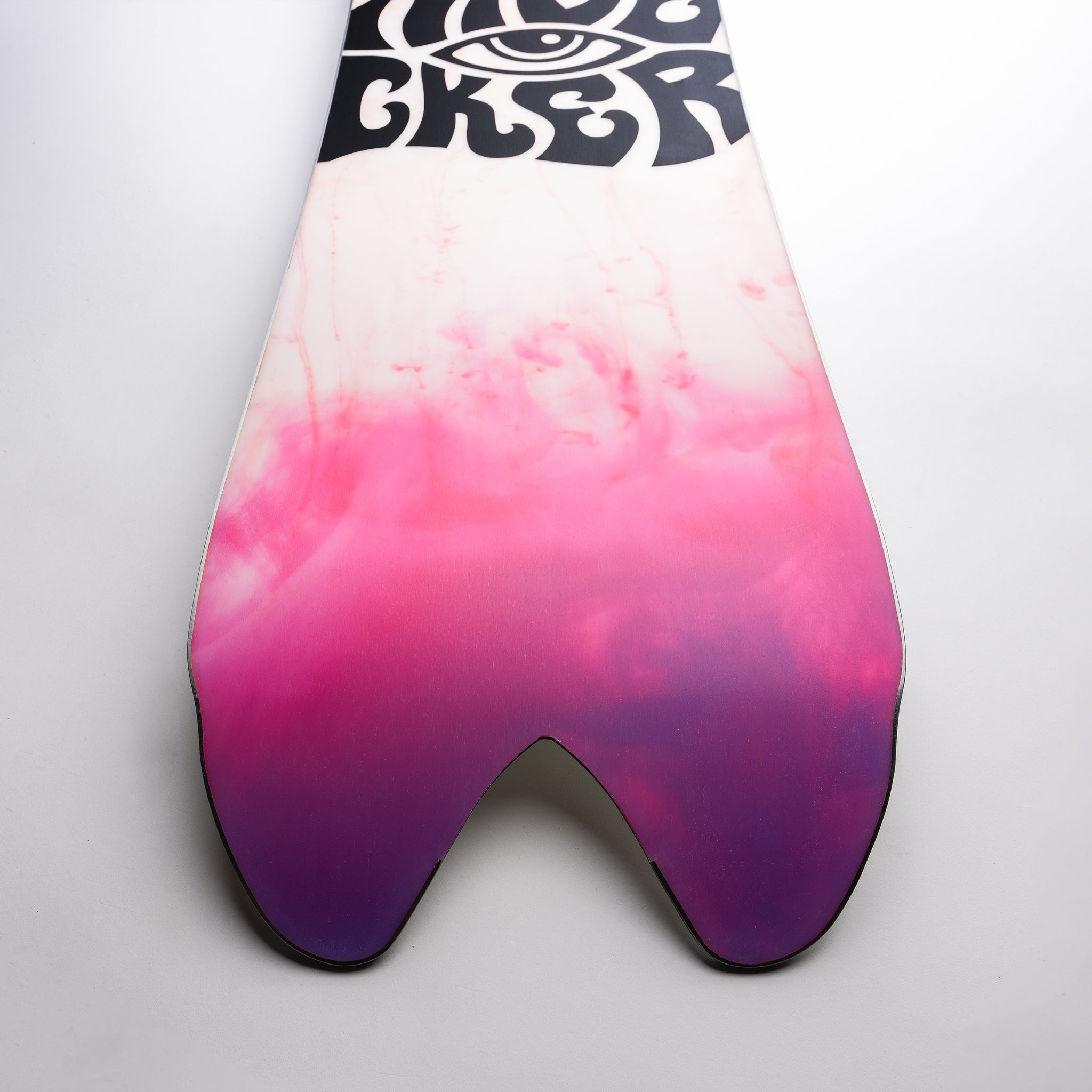 Nidecker Beta Snowboard 2025 - A white snowboard with a black logo featuring an eye and the word "nidecker" in stylized letters, set against a gray background.