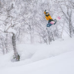 Nidecker Beta Snowboard 2025 - A snowboard with a black base and white lettering, featuring a distinctive logo on its top side.