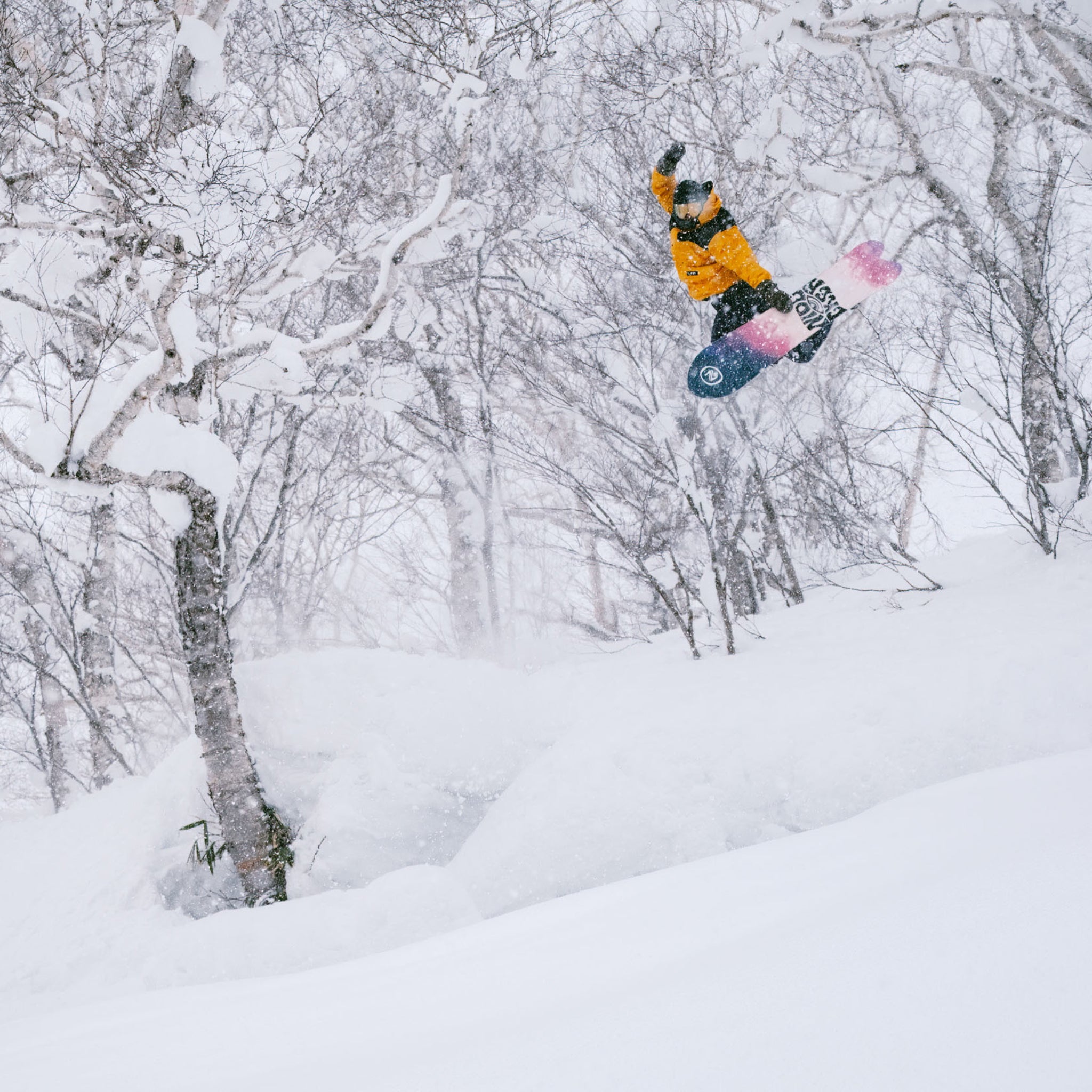 Nidecker Beta Snowboard 2025 - A snowboard with a black base and white lettering, featuring a distinctive logo on its top side.
