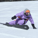 Nidecker Blade Snowboard 2025 - A black snowboard with a white logo on its bottom edge, featuring a blurred rider in motion.