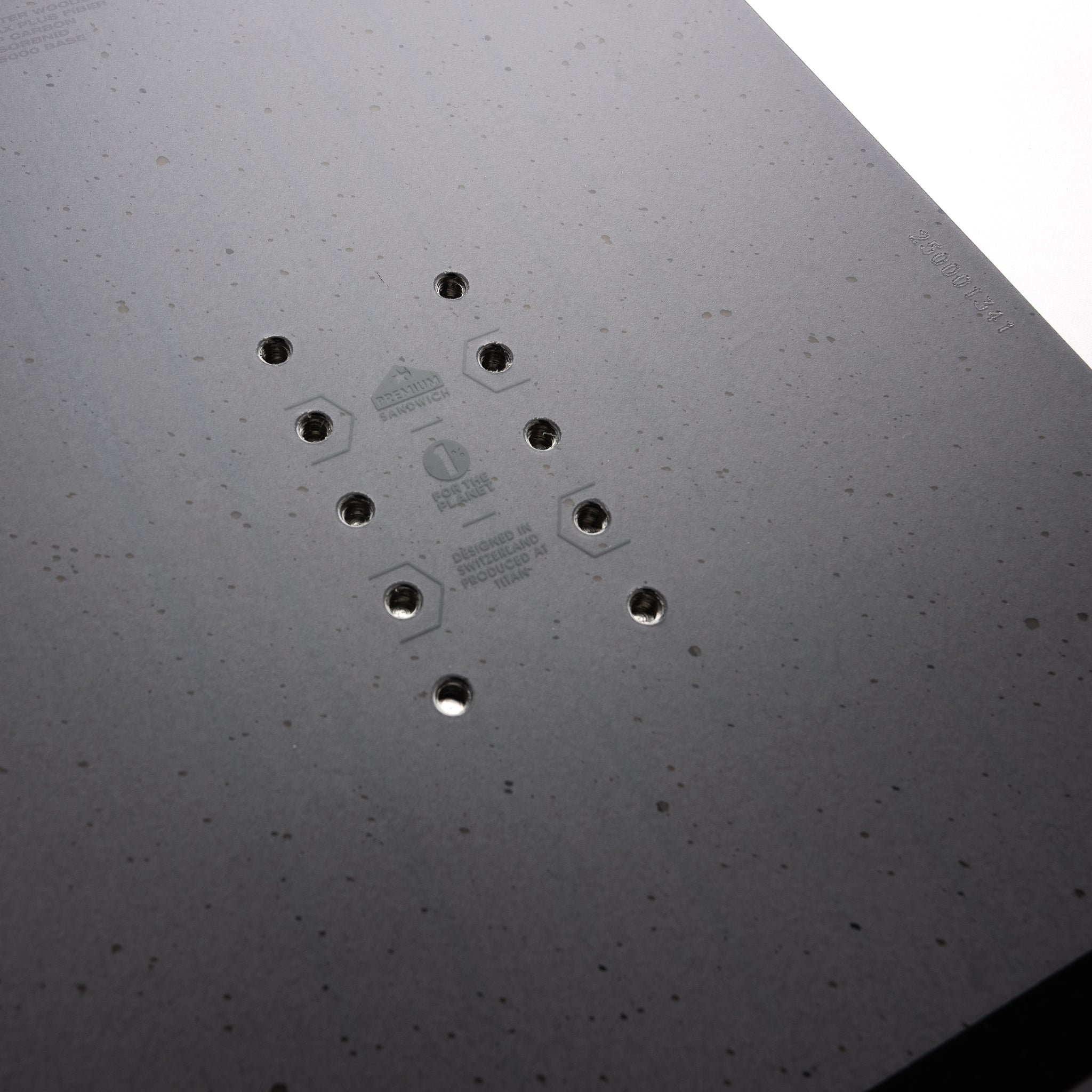 Nidecker Merc Snowboard 2025 - A black snowboard with a white logo on top and a white stripe along the bottom edge.