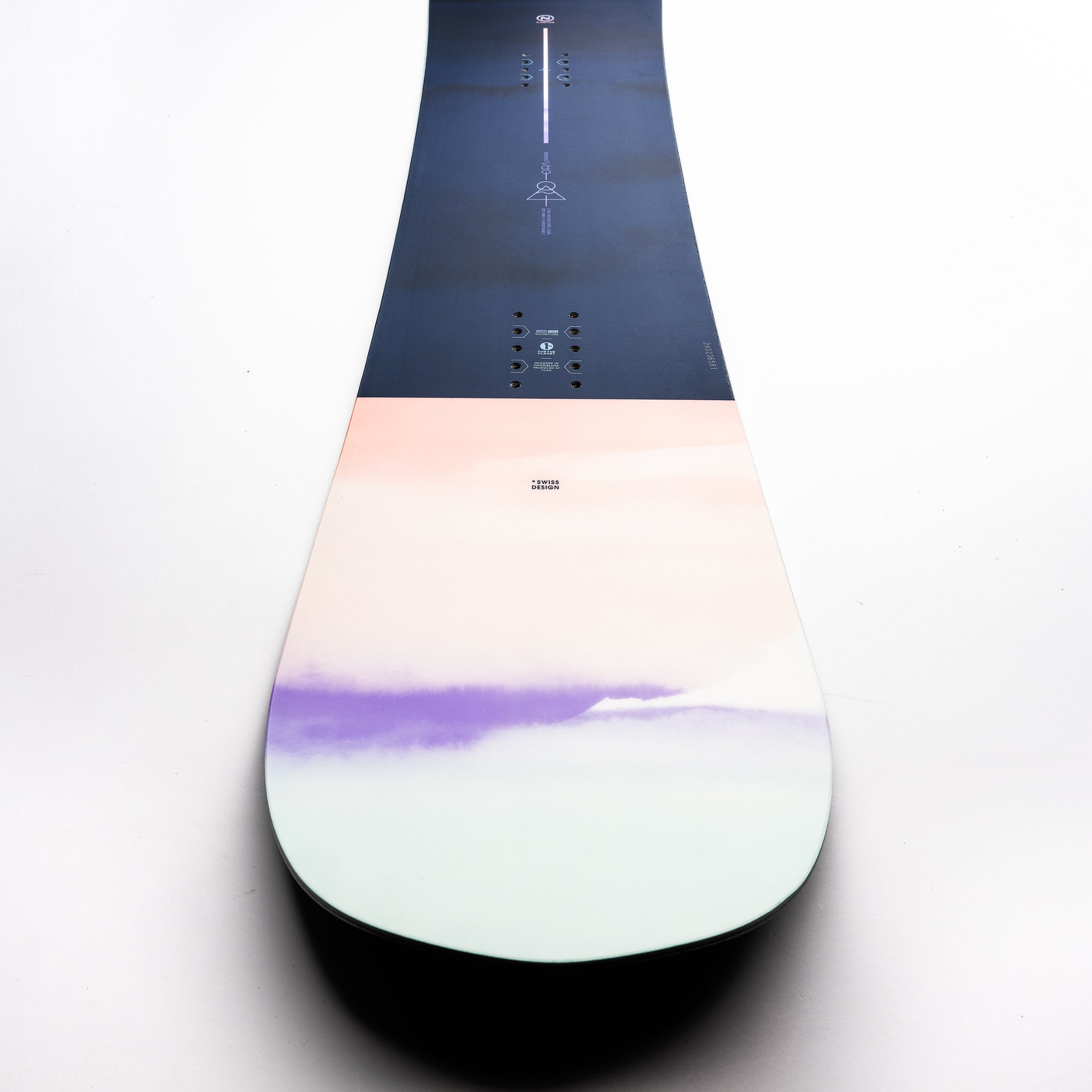 Nidecker Ora Women's Snowboard 2025 - A navy blue snowboard with a white and purple ombre design at the tip.