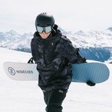 Nidecker Play Snowboard 2025 - A white snowboard with a blue logo and black writing, featuring a dark gray pattern of abstract shapes.