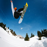 Nidecker Sensor Pro Snowboard 2025 - A yellow, black, and white snowboard with a black logo that reads "NIDECKER" in large letters on its underside.