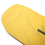 Nidecker Sensor Team Snowboard 2025 - A yellow snowboard with a black logo on the top left corner and a white stripe running down the middle.