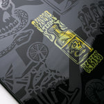 Nidecker Sensor Team Snowboard 2025 - A black snowboard with a white and yellow logo on top of it.