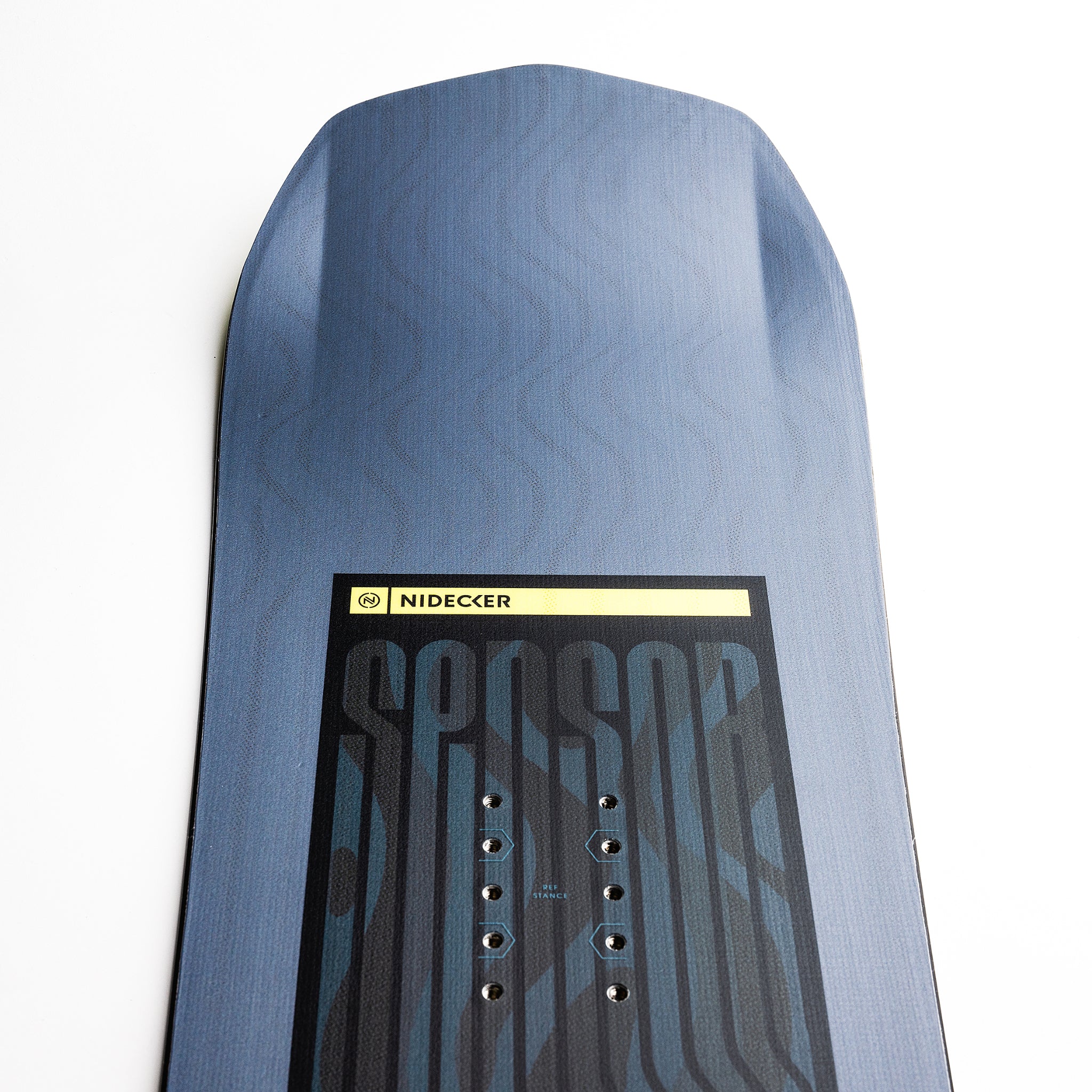 Nidecker Sensor Youth Snowboard 2025 - A blue snowboard with a black graphic design and white lettering, featuring a geometric pattern on its top surface.