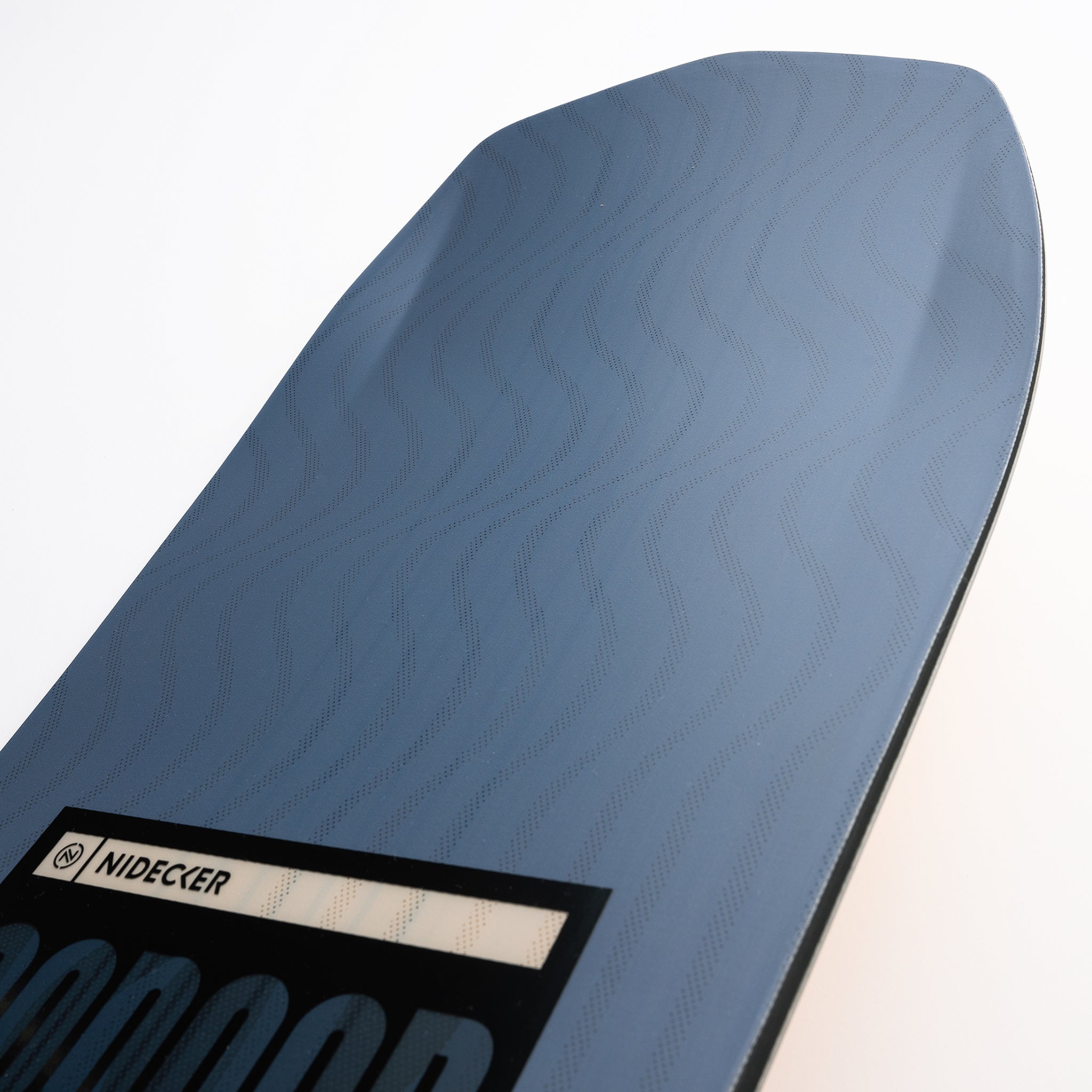 Nidecker Sensor Snowboard 2025 - A blue snowboard with a wavy pattern and black binding mounts.