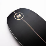 Nidecker The Smoke Snowboard 2025 - A black snowboard with a white logo featuring a stylized "Z" and a thin, horizontal line through it.