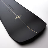 Nidecker The Smoke Snowboard 2025 - A black snowboard with a white stripe down the middle and two white wings on either side of it.