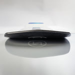 Nidecker Thruster Snowboard 2025 - A black snowboard with a white logo on top, lying flat on its side.