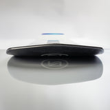 Nidecker Thruster Snowboard 2025 - A black snowboard with a white logo on top, lying flat on its side.