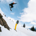 Nidecker Thruster Snowboard 2025 - A black snowboard with white lettering and a circular logo on its bottom edge, viewed from above.