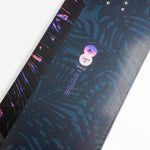 Nidecker Venus Plus Women's Snowboard 2025 - A navy blue snowboard with a pink and purple abstract design on top of a white background.