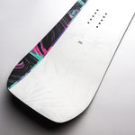 Nidecker Venus Women's Snowboard 2025 - A black snowboard with a pink and teal marbled pattern on its top edge.