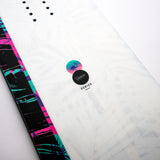 Nidecker Venus Women's Snowboard 2025 - A white snowboard with a pink and purple palm tree pattern on the top sheet, featuring a black base.